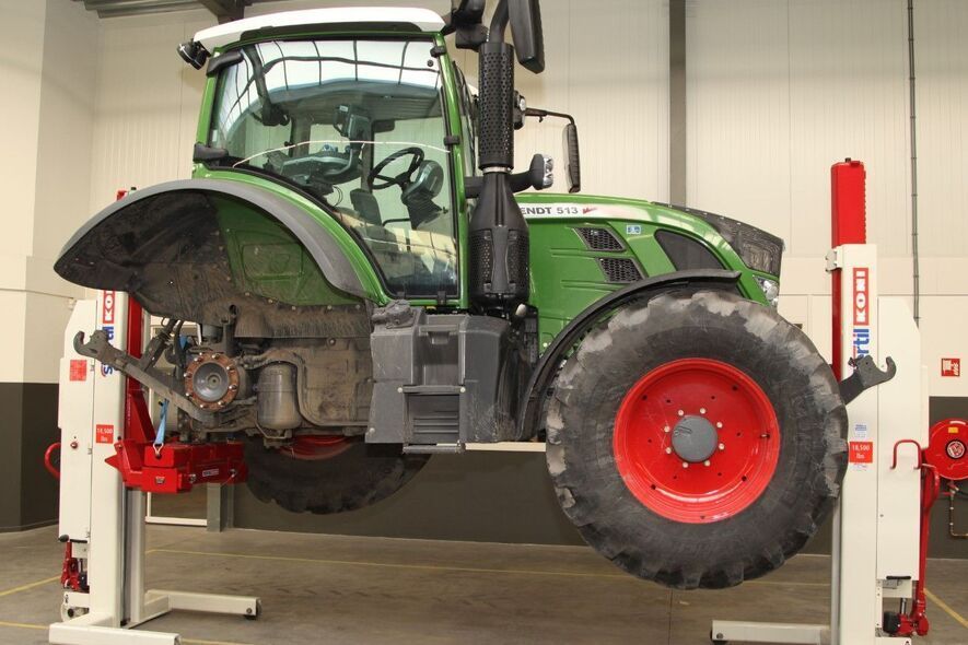 tractor on 2 mobile lifts